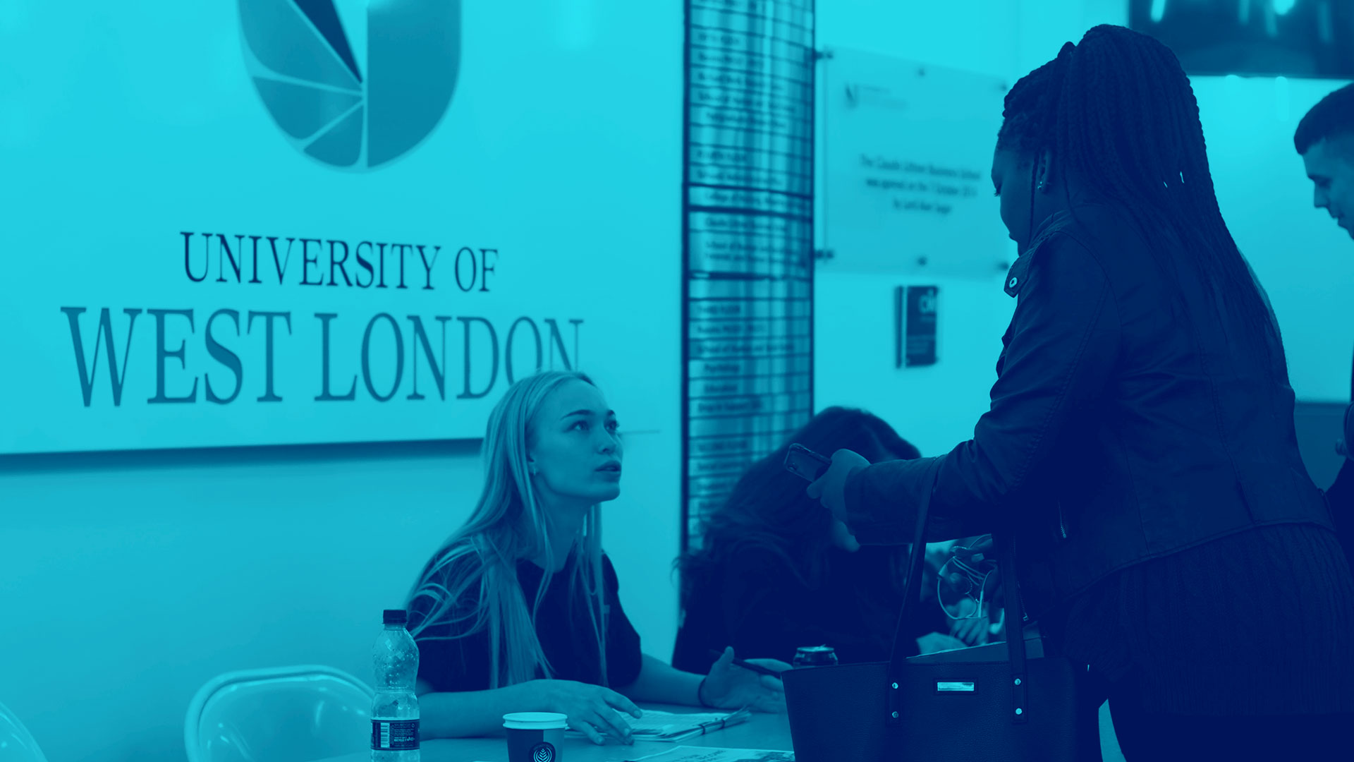 A student staff talking to a student