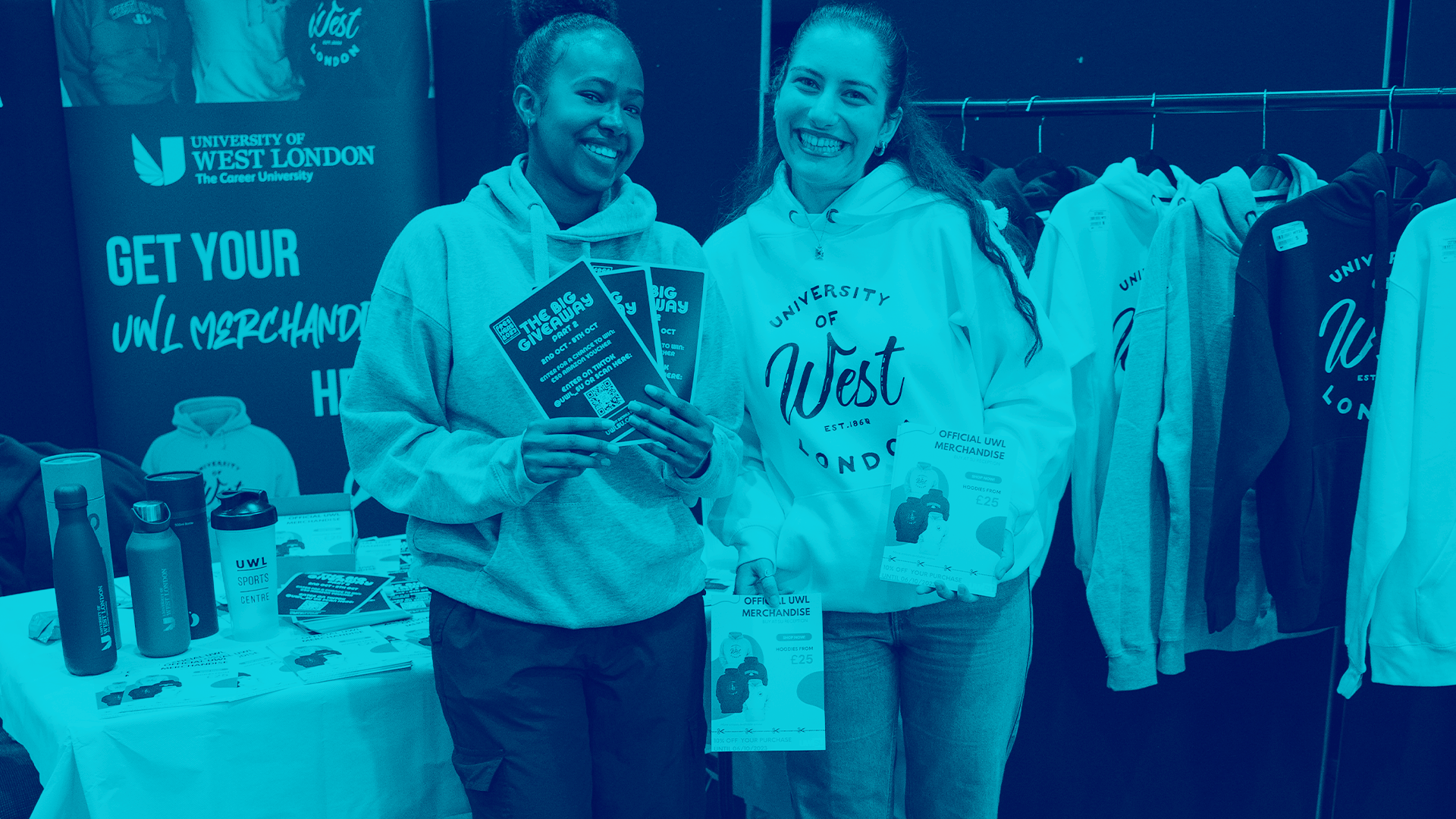 Staff walking up stairs with a 'Hello West London' backdrop