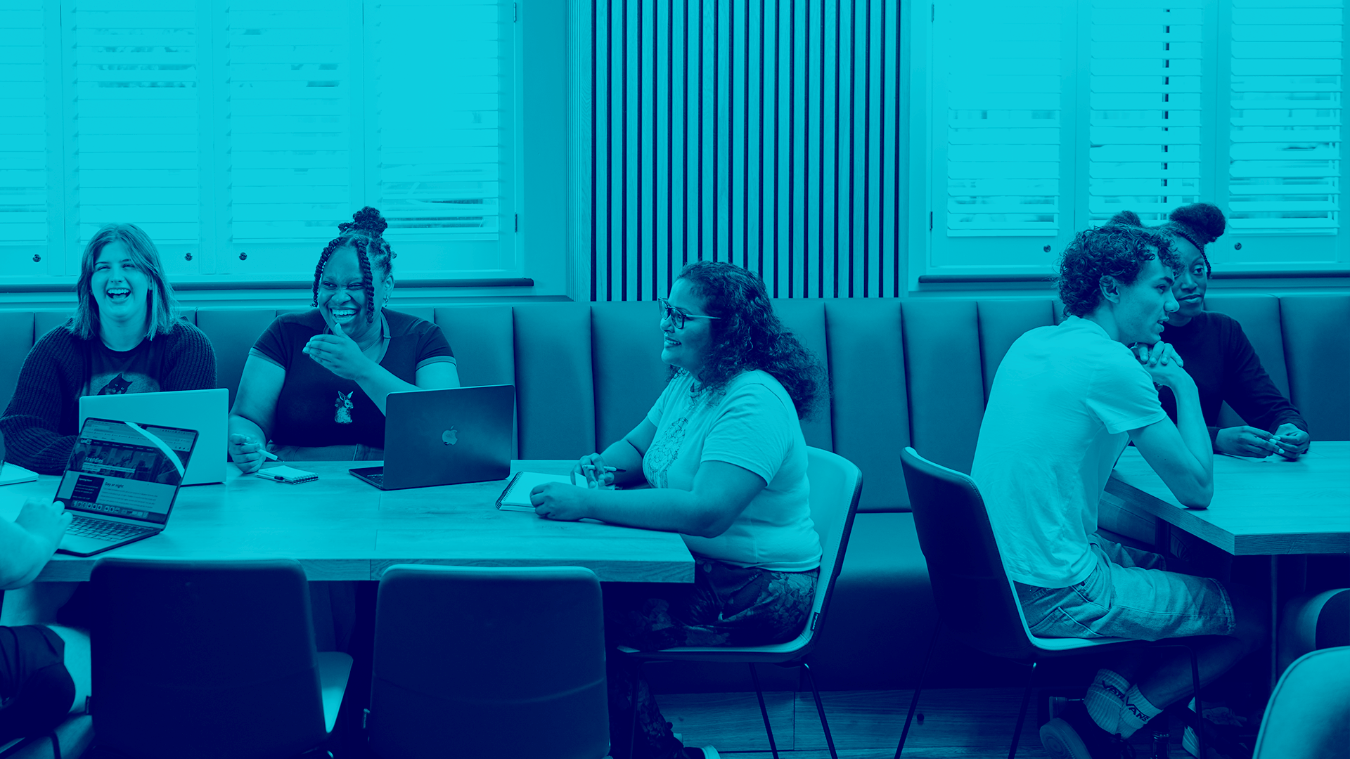 students laughing together in Freddie's