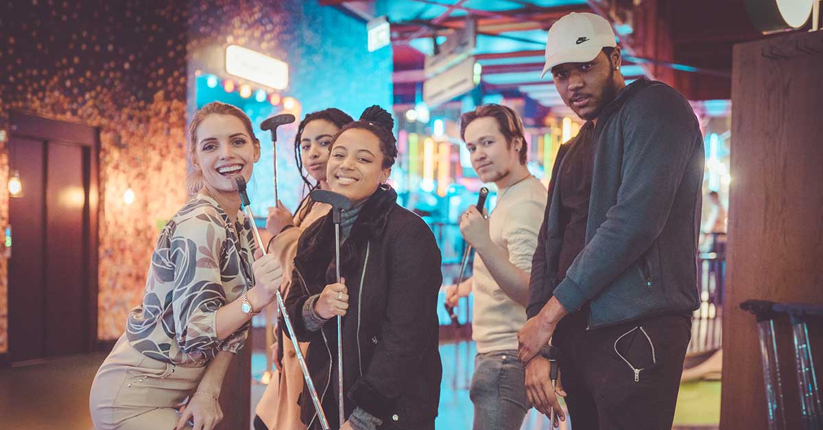 Students attending a mini golf event